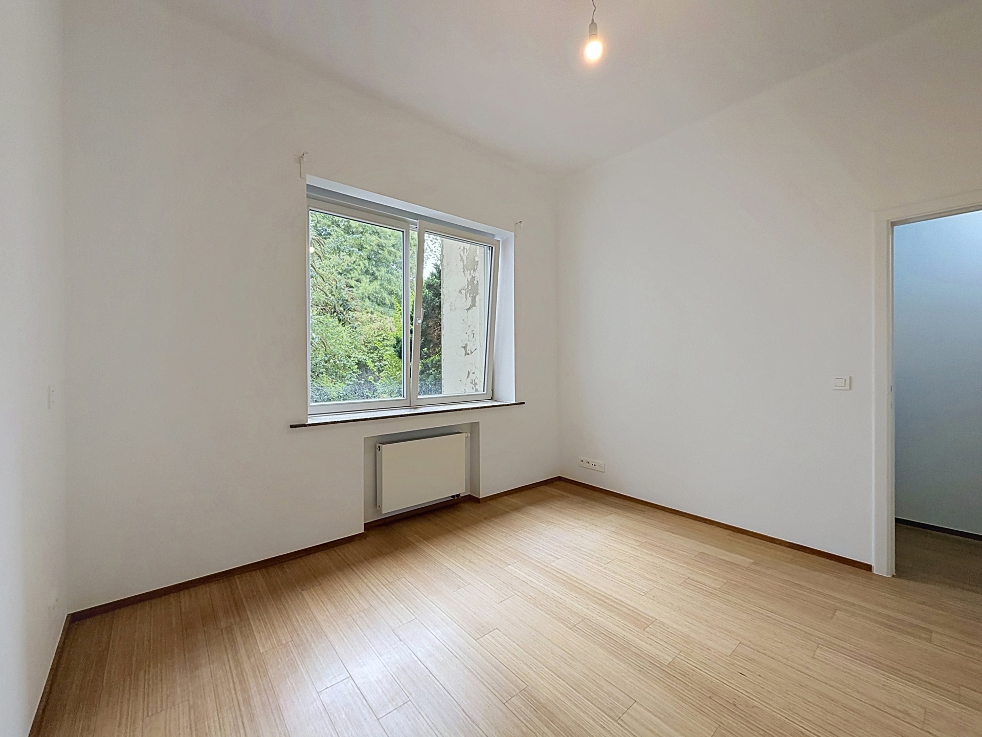 Foto 3 van 4 van Gelijkvloerse verdieping met twee slaapkamers in Etterbeek